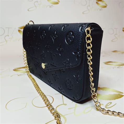 louis vuitton black small purse.